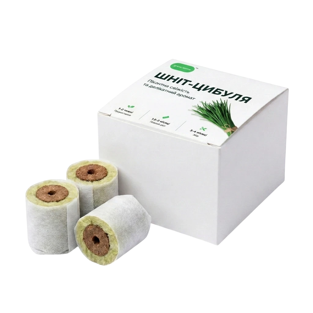 Три змінні капсули зі шніт-цибулею grow-some та біла картонна упаковка для гідропонних систем на чорному фоні